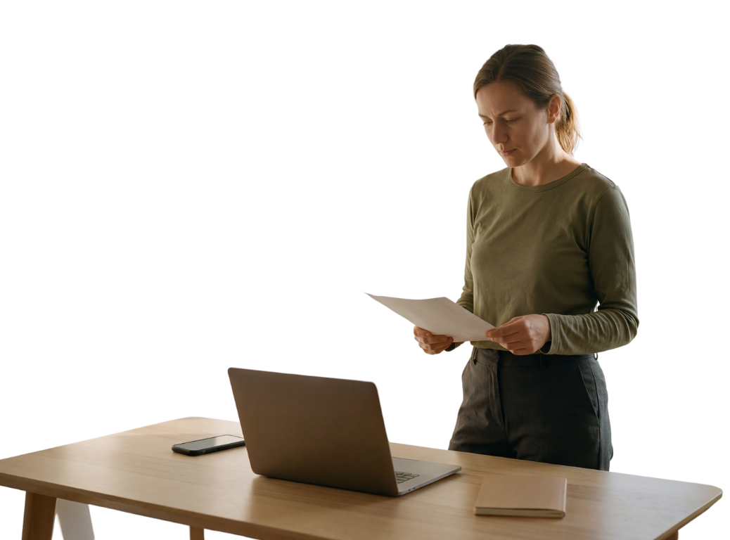 Recruiter reviewing a candidate resume while Credibled runs identity and criminal record checks