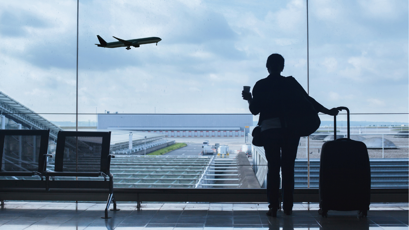 Candidate at an airport departure gate before relocating to Canada for work